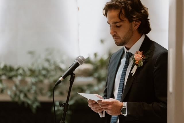 Picture of myself doing a reading at my sister's wedding